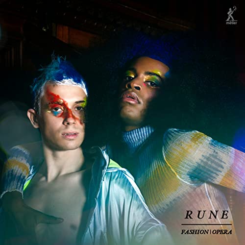 CD cover: two people with colorful face paint and dramatic lighting.