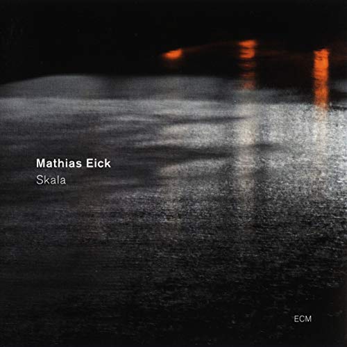 Vinyl album cover with dark, reflective surface and white text "Mathias Eick Skala".