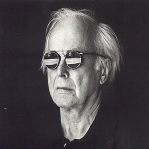 Black and white portrait of Torkel Rasmusson wearing round sunglasses.