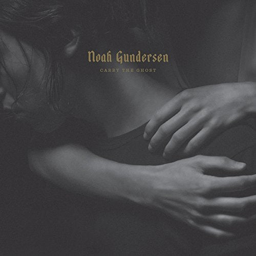 Album cover with dark, shadowy hands and gold text "Noah Gundersen, Carry the Ghost".