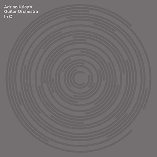 Vinyl record cover: concentric circles on a dark gray background.
