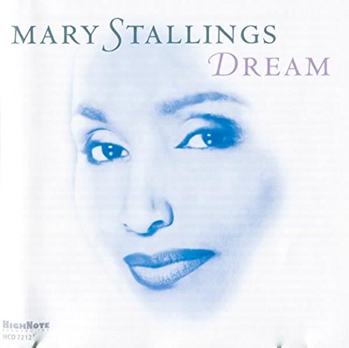 "Album cover with a blue-toned close-up of a woman's face and artist's name."