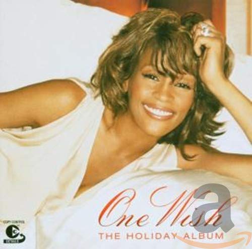 Whitney Houston album cover, “One Wish - The Holiday Album”, smiling portrait.