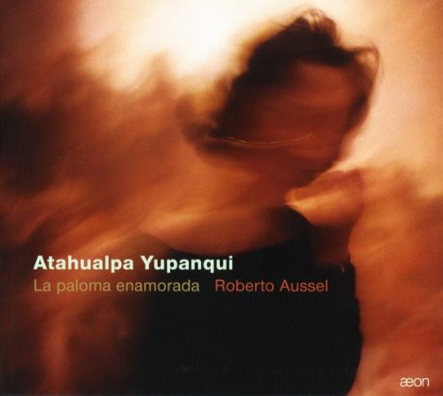 A CD cover with a blurry man in dark clothing and orange background.