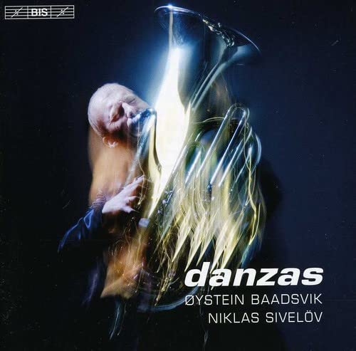 CD cover featuring a tuba player with light streaks, titled "Danzas".