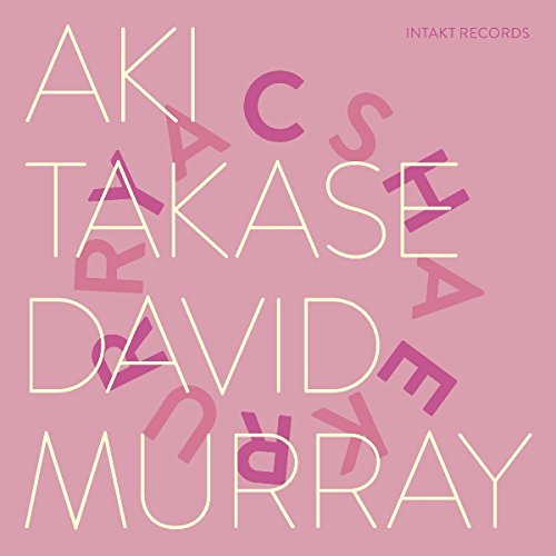 Pink album cover with white and purple text, featuring artist names and record label.