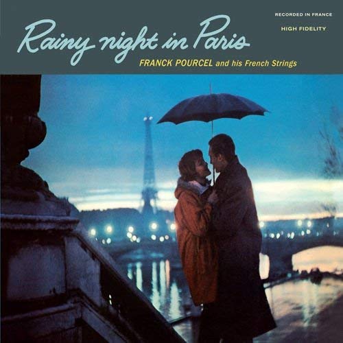 CD cover: Couple embracing under an umbrella with the Eiffel Tower visible.
