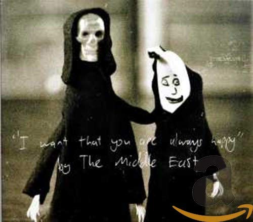 Two cloaked figures with skull-like faces stand close together.