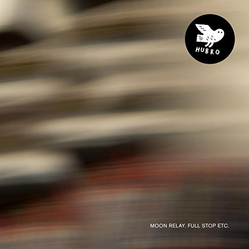 The image depicts a blurry background with a black circular logo featuring a white bird and the text "HUBRO" in the top-right corner. The product title "MOON RELAY. FULL STOP ETC." is displayed in small white text at the bottom. Alt text: Blurred background with black logo and white text.