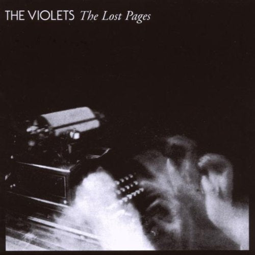 Black and white CD cover with a typewriter and blurred guitar.