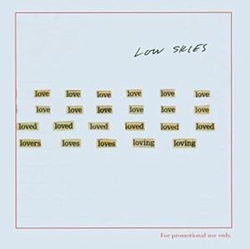 "Album cover with 'Low Skies' title and 'love' variations on a light background."