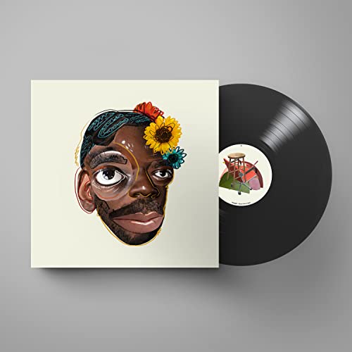 Vinyl record with illustrated album cover featuring a man’s face and flowers.