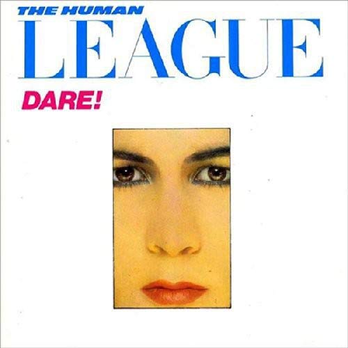 Album cover with a woman's face and blue and pink text on white background.