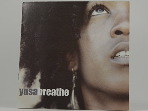 CD cover for Yusa’s “Breathe” featuring a close-up of a woman’s face.