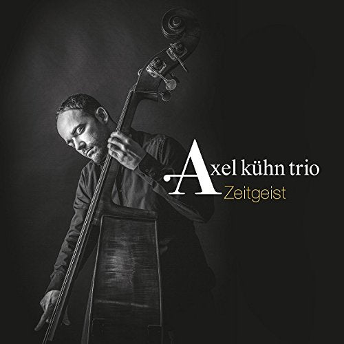 "CD cover featuring a man playing a double bass, with text 'Axel Kühn Trio - Zeitgeist'."