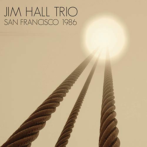 "Album cover with three cables and a bright light, beige background, text 'Jim Hall Trio'."