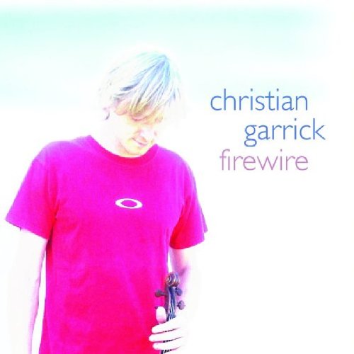 "Album cover featuring a man in a pink shirt holding a violin."