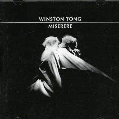 "Album cover with a black background and a blurry, white figure in motion."