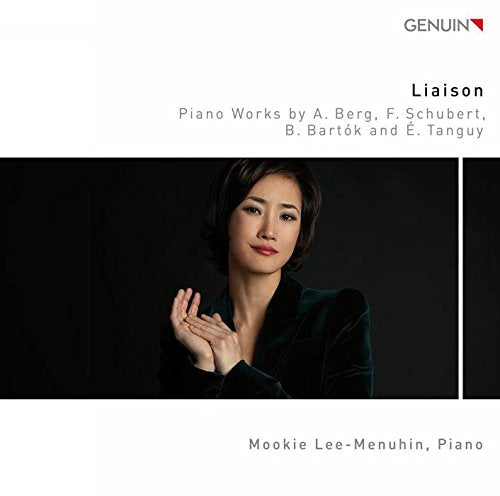 "CD cover with a woman in a black shirt against a dark background."