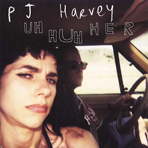 PJ Harvey “Uh Huh Her - Demos” vinyl record and polaroid images.