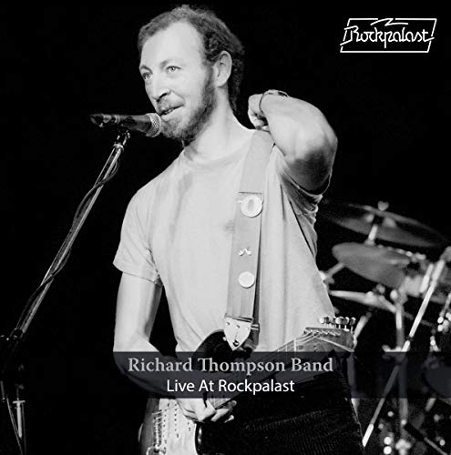 Black and white album cover featuring a man singing into a microphone with a guitar.