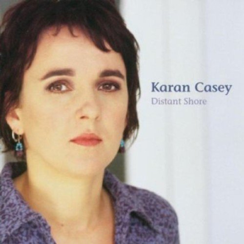 "Karan Casey's album cover, featuring a woman with short dark hair and purple shirt."