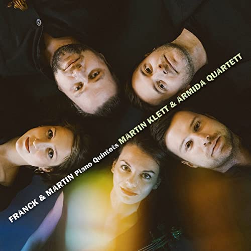 Five musicians’ faces arranged in a circle with album title text.