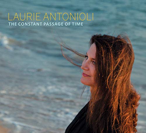 "Album cover featuring a woman with long hair blowing in the wind."