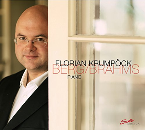 Album cover featuring a bald man in a suit beside a window.