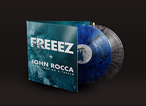 Vinyl record with marbled blue and black coloring, and album cover.