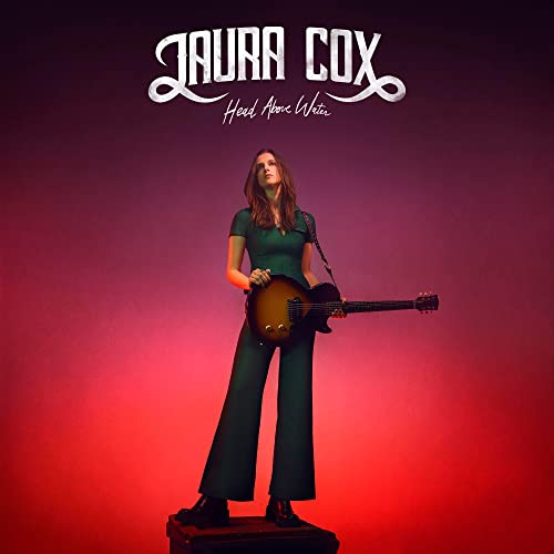 Laura Cox album cover featuring a woman with a guitar.