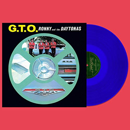 "Blue vinyl record with black album cover featuring a collage of images."