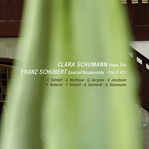 A CD cover with blurred green background and white and black text overlay.