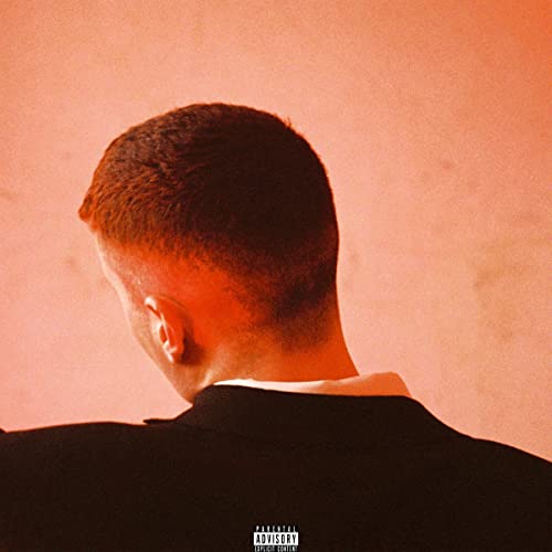 Album cover: back of a man’s head against an orange background.