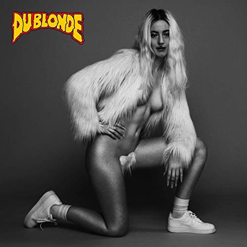 Black and white album cover featuring a kneeling woman in a fur coat.