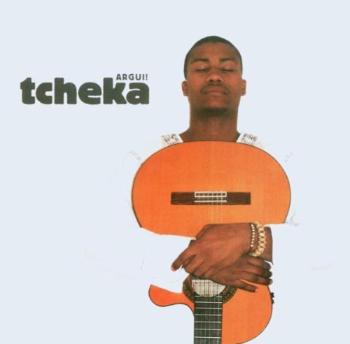 Man holding an orange guitar, with eyes closed, on a white background.