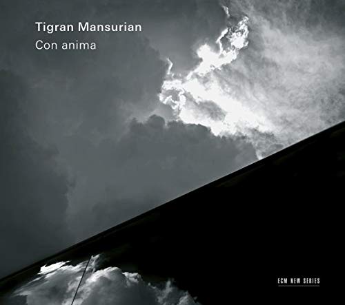 A CD cover featuring a cloudy sky reflected on a dark surface.