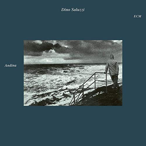 "Music album cover with a man standing on a dock in a stormy sea."