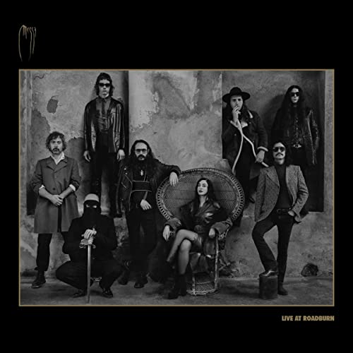 Black and white photo of six people, band Messa, in front of a wall.