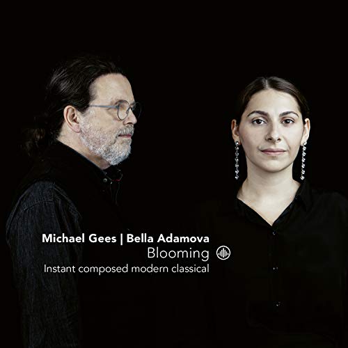 A man and woman in black clothing against a black background, with white text overlay.