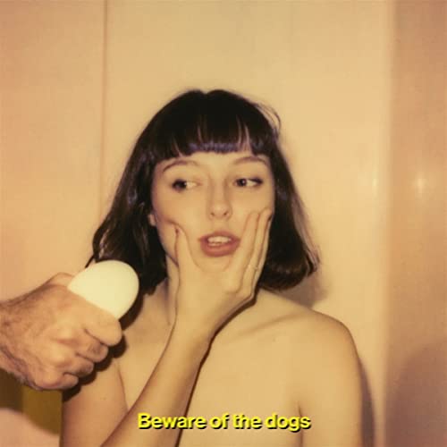 Stella Donnelly album cover: woman with egg, yellow background, text.