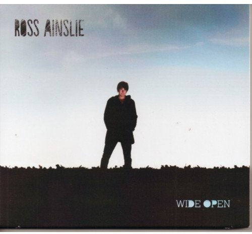 "CD cover featuring a man standing in a field with 'Ross Ainslie Wide Open' text."