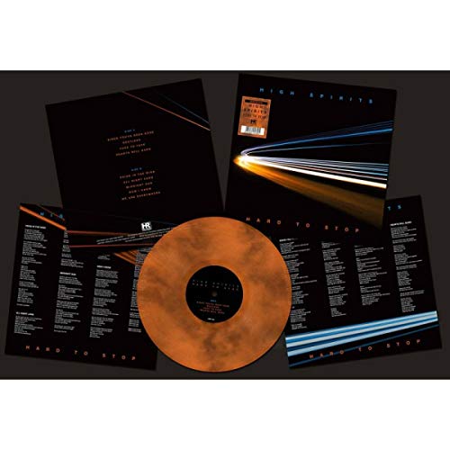 Marbled brown vinyl record with album artwork and lyric sheets displayed.