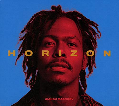 Jeangu Macrooy album cover, portrait with red-toned hair and yellow text.
