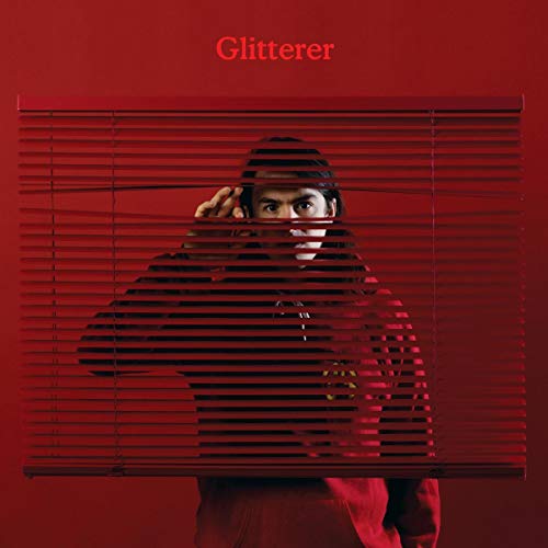 Red album cover featuring a person partially obscured by blinds.