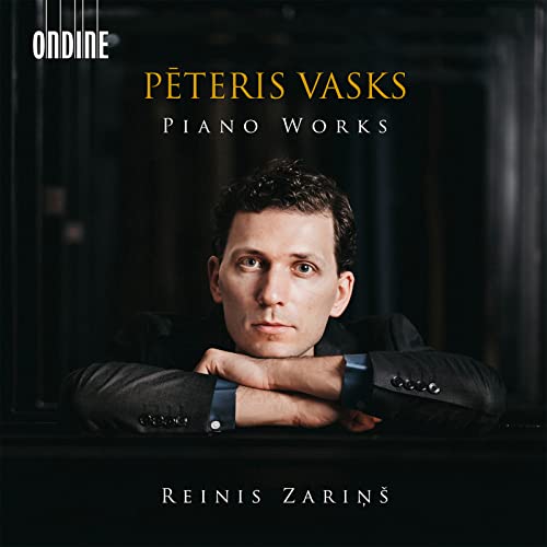 CD cover featuring portrait of pianist Reinis Zarins in a suit.