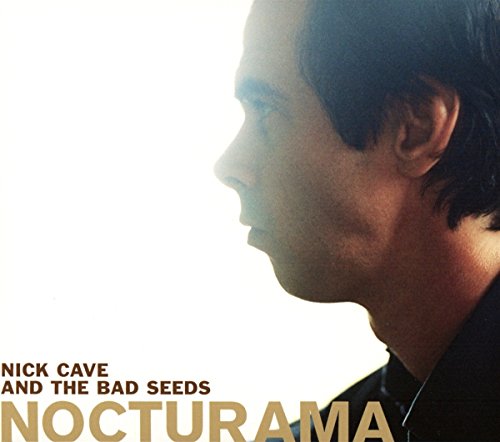 Album cover with a man's profile and gold text on a white background.