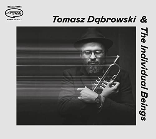 Portrait of Tomasz Dąbrowski holding a trumpet, album cover for “The Individual Beings.”