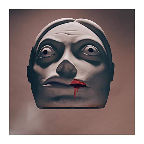 Gray sculpted face with red dripping from the open mouth.