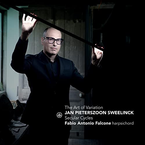 CD cover featuring a man in black with raised arms, text details.